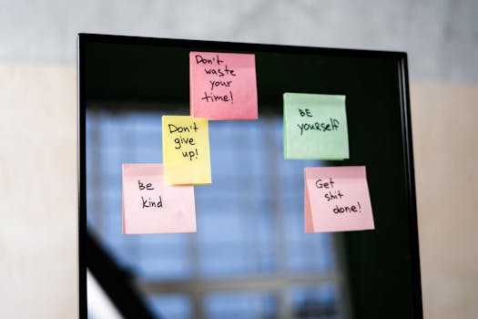 Colorful sticky notes on a mirror provide daily motivational messages and positivity reminders.