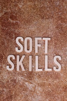 Image of 'Soft Skills' text on a textured stone background, emphasizing personal development.